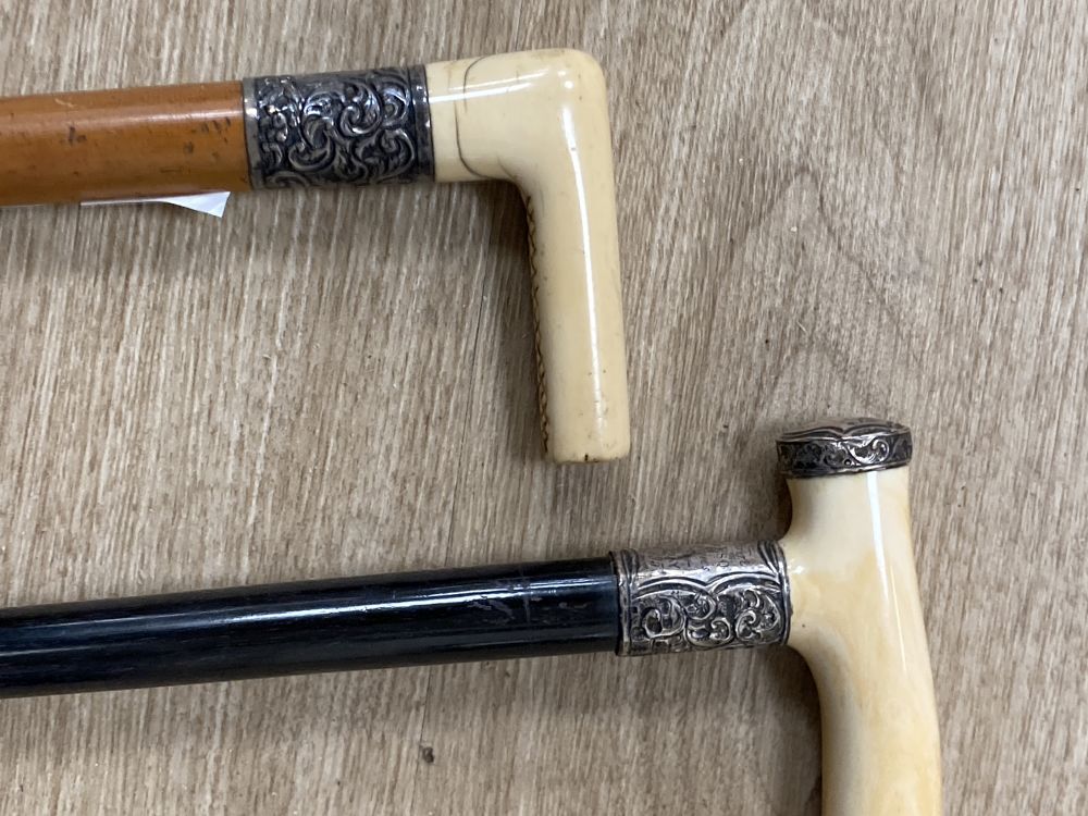 Two Victorian silver mounted ivory handled walking canes